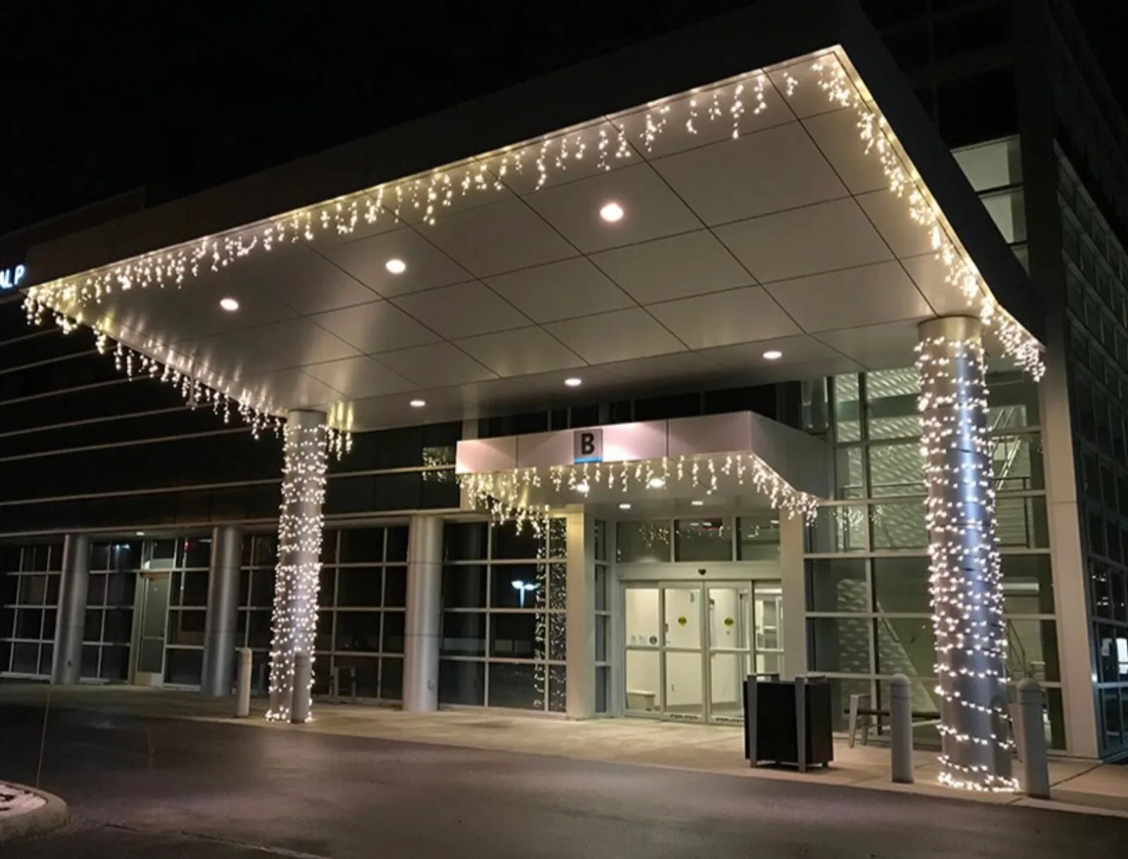 Commercial building entrance with professional holiday lighting