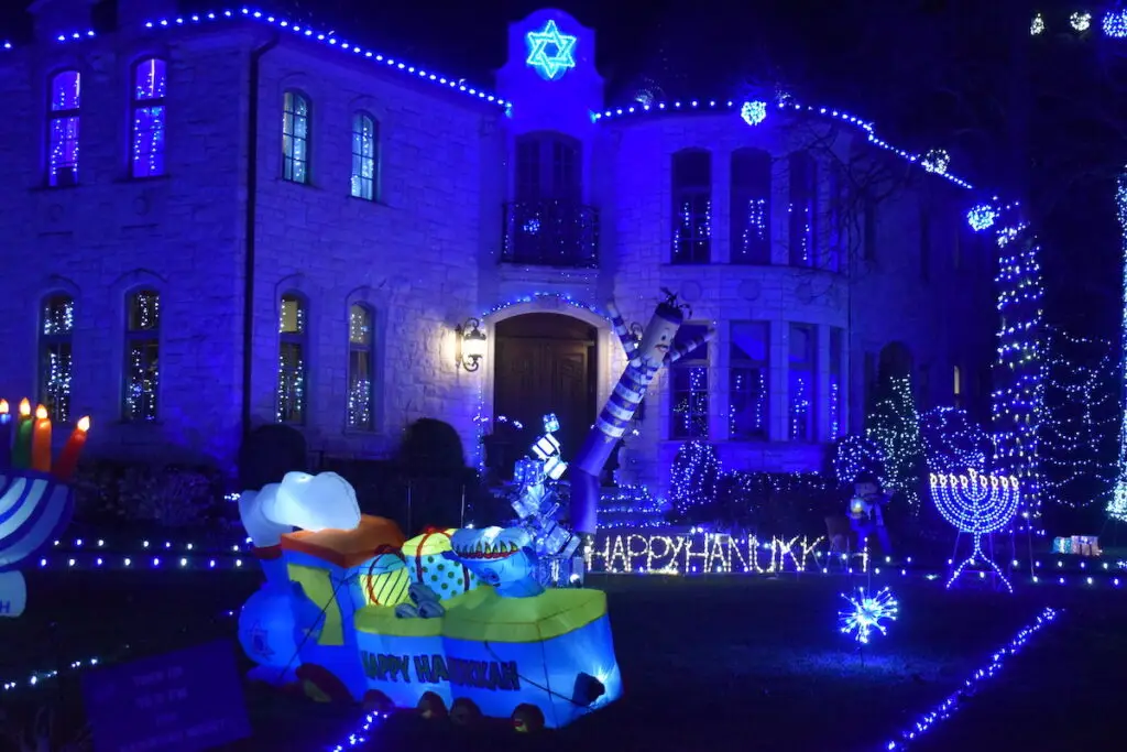 Home with elegant blue-and-white Hanukkah lighting installed by Homefront Power Wash