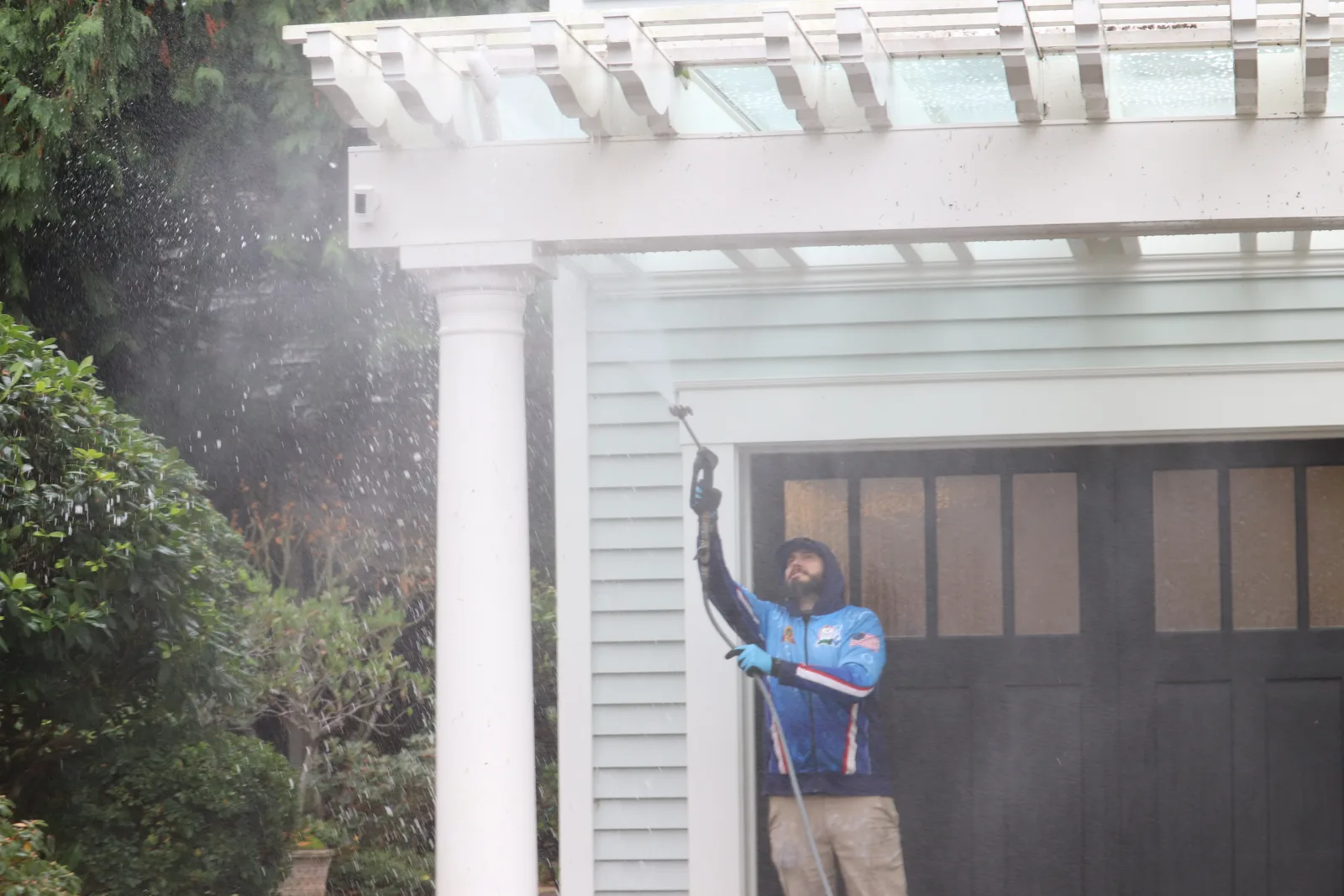 Homefront Power Wash crew cleaning a fence (verify)
