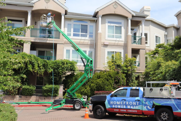 Homefront Power Wash cleaning the exterior of an apartment complex in Bellevue, WA