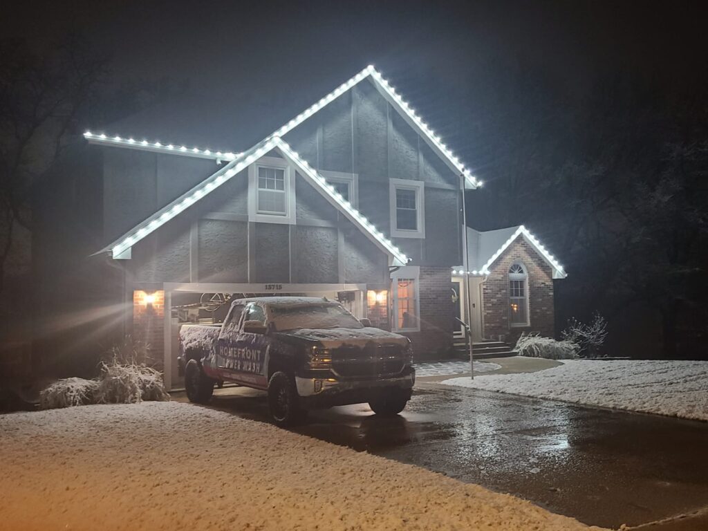 Homefront Holiday Lights with their Homefront Power Wash truck installing holiday lights