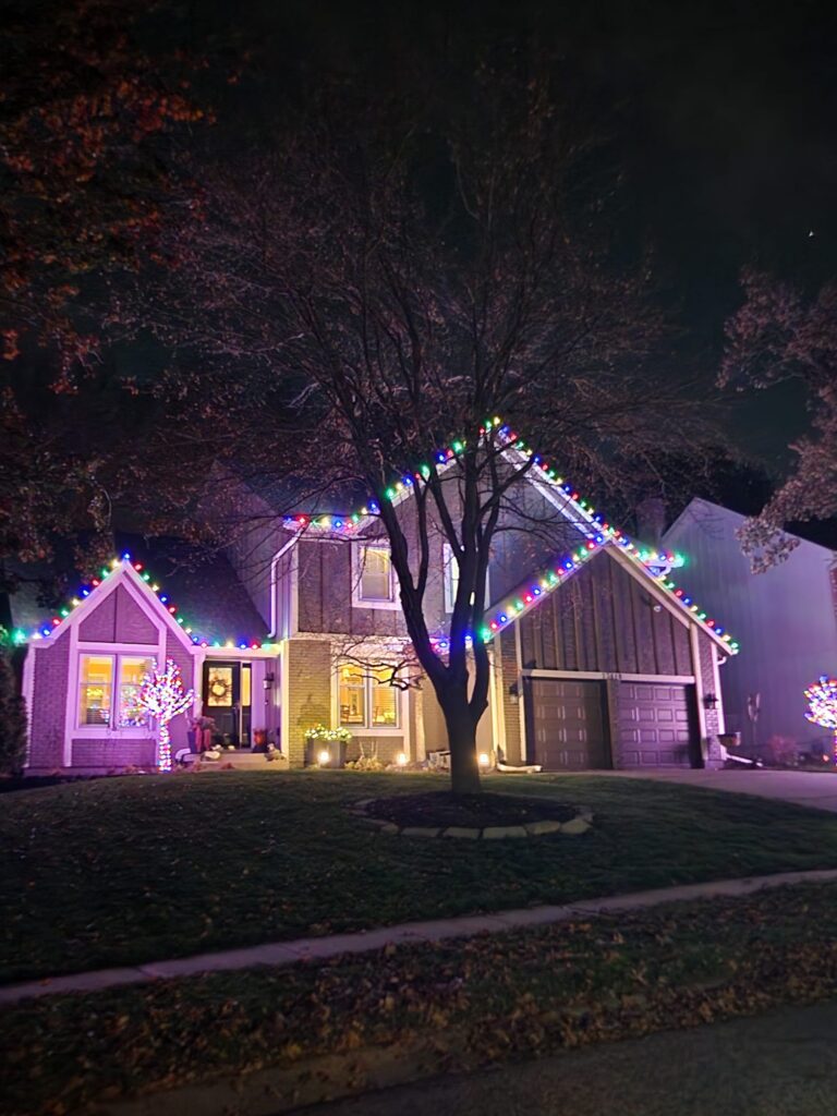 Very colorful holiday light display installed by Homefront Holiday Lights