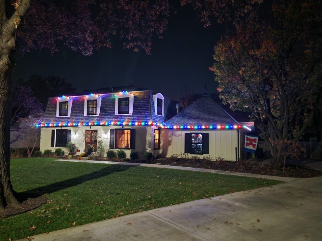 Homefront Holiday Lights shining bright during the night on a beautiful house in the Seattle/Eastside Area