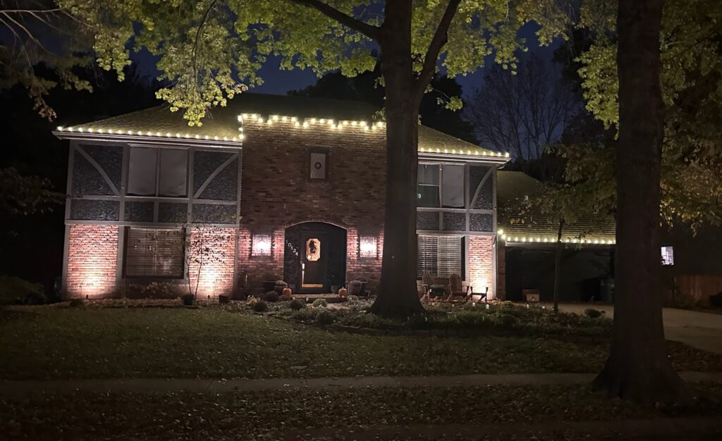 Beautiful contemporary home with holiday lights installed by Homefront Holiday Lights